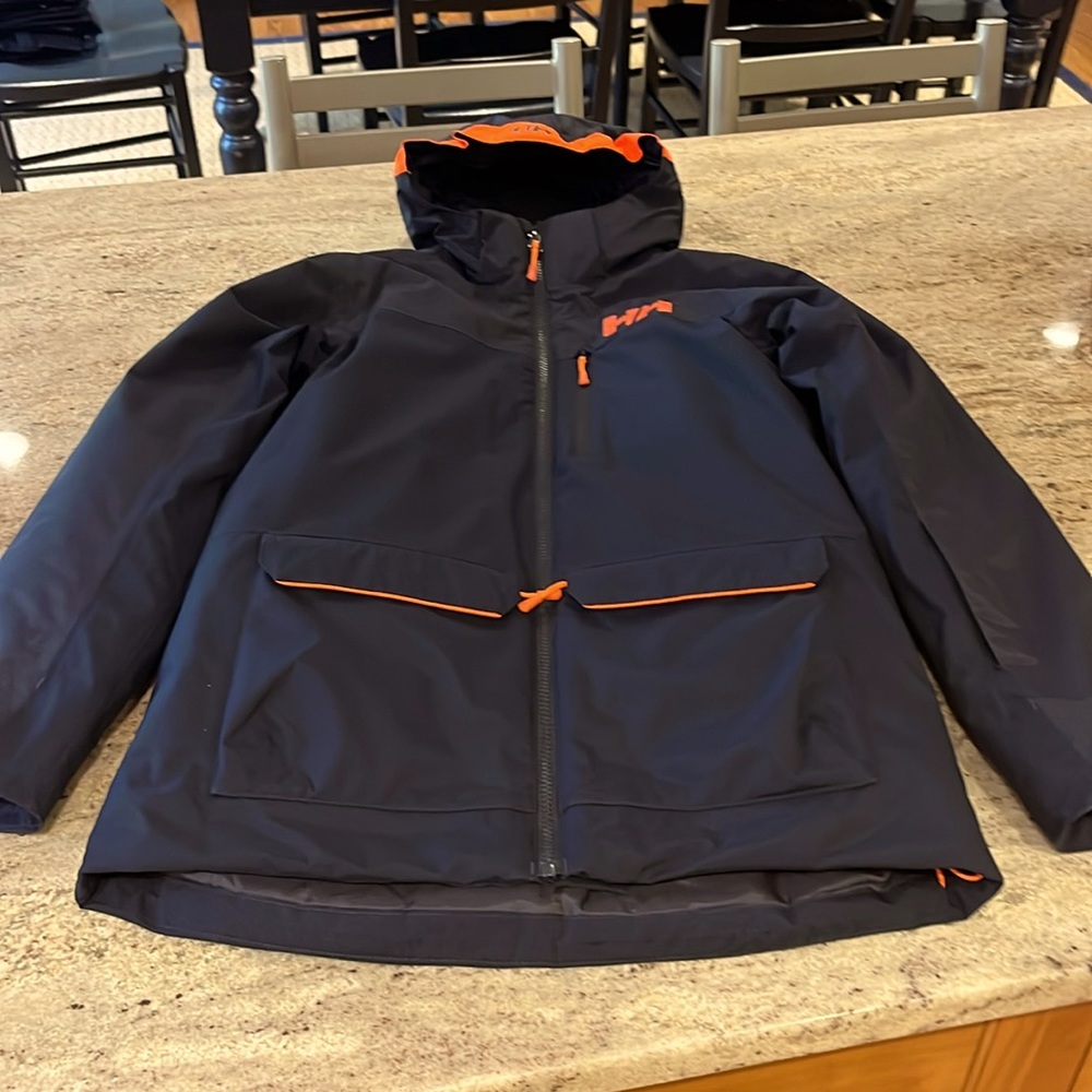 Helly Hansen Juniors Insulated Jacket. Navy/orange. Excellent condition. Sz14
